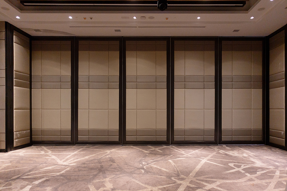 Photo of four stagger stacked grey Absorption Plus panels