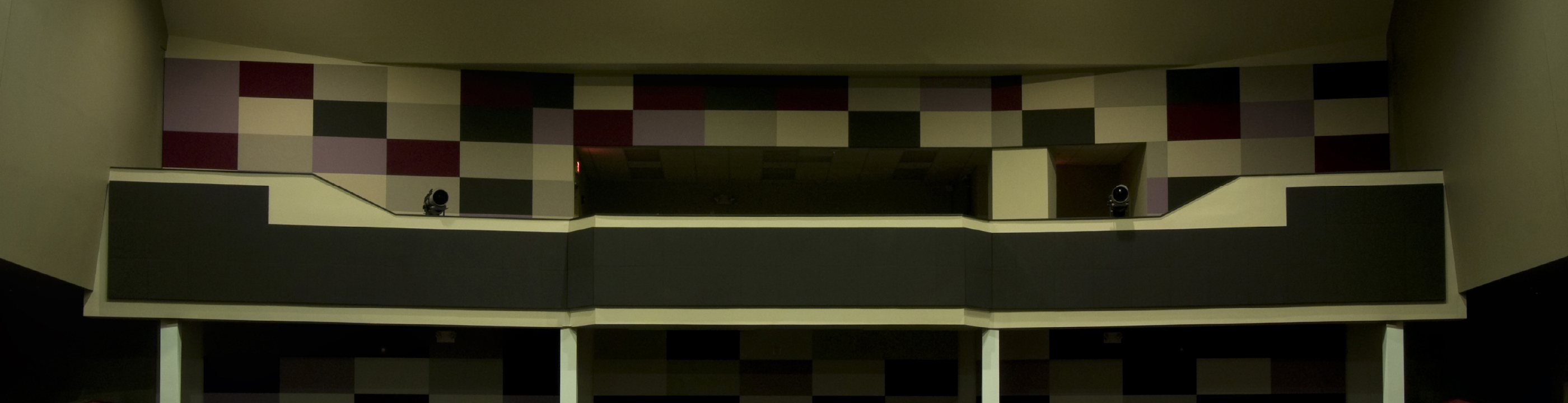 Photo of large colorful insulated wall at back of an auditorium