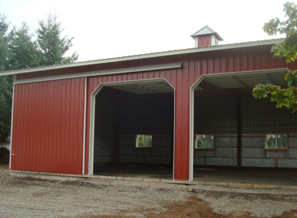 Photo of warehouse ceiling showing insulated piping and ducts