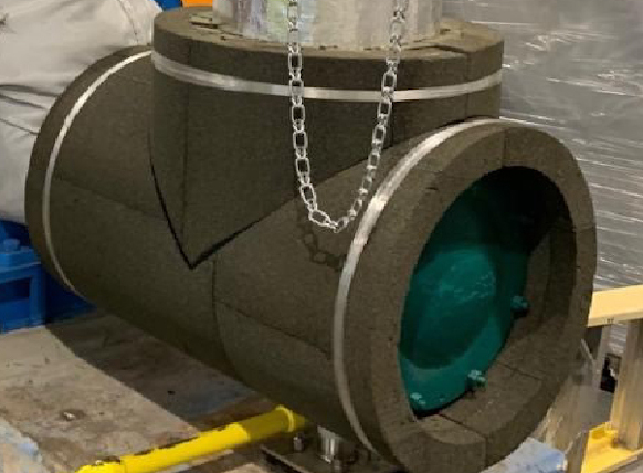 Photo of a large industrial pipe-T with custom fit insulation
