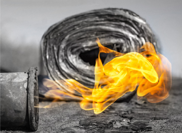 Photo of a piece of insulated duct with fire flaming from the open end