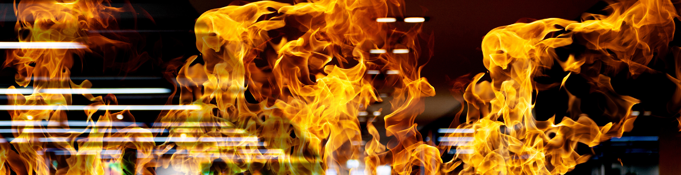 Three yellow industrial fire flames