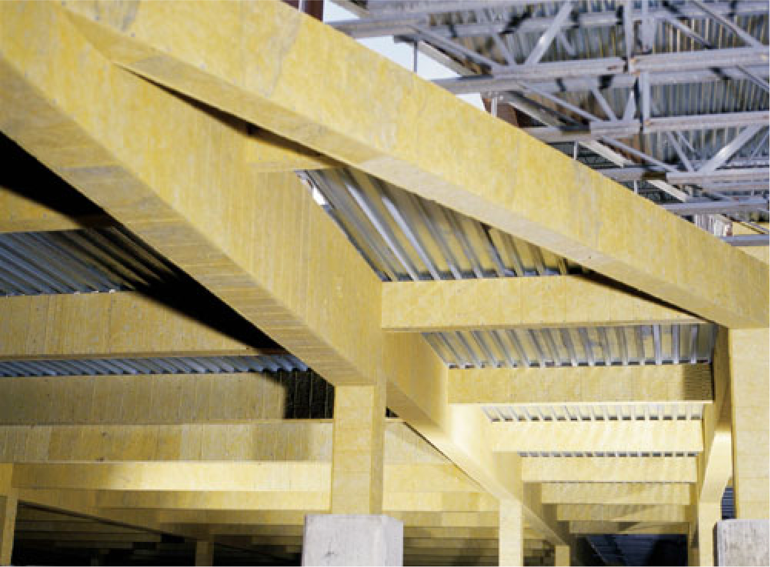 Photo of large structural beams coating in insulation